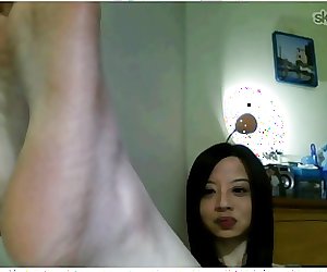 Taiwanese woman shows feet on Skype